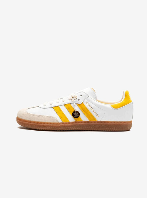 Adidas Samba Sneakers in Weiß und Gold, stilvoll und elegant.