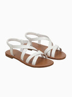 Elegante goldene Criss-Cross flache Sandalen für Damen.